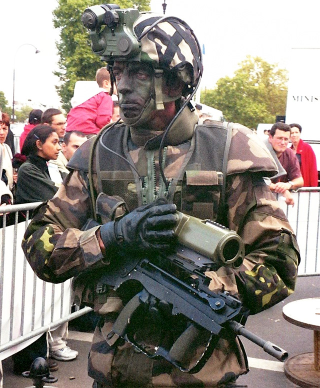 Illustration for article titled Project Run-a-Way: The Craziest Combat Outfits